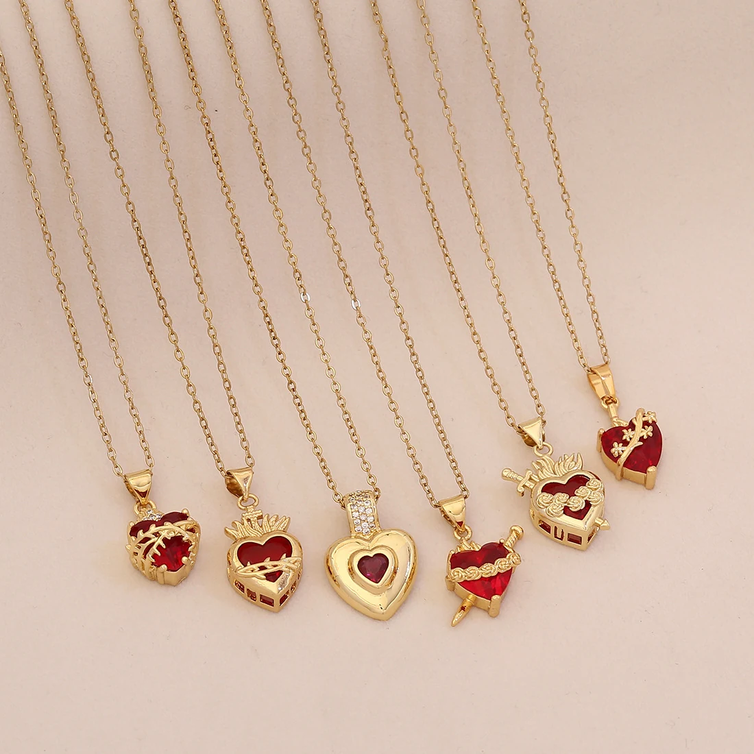 Six red heart pendant necklace styles displayed together