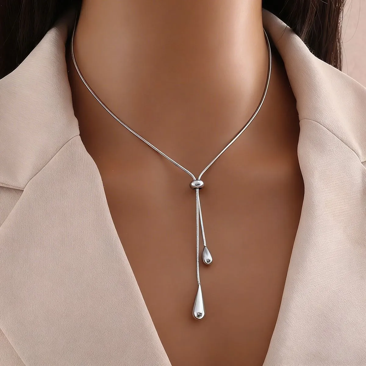 Silver teardrop tassel stainless steel necklace on model
